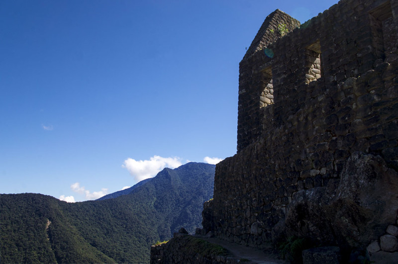 looking up at stone house on Huayna Picchu