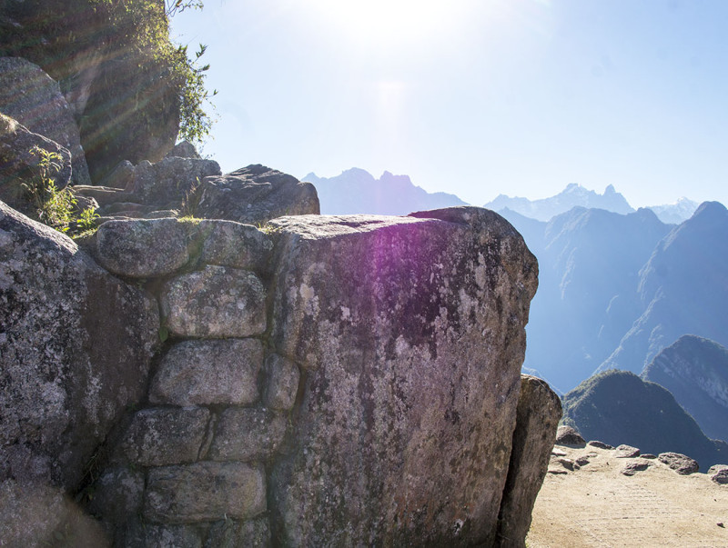 sun filtering through stones