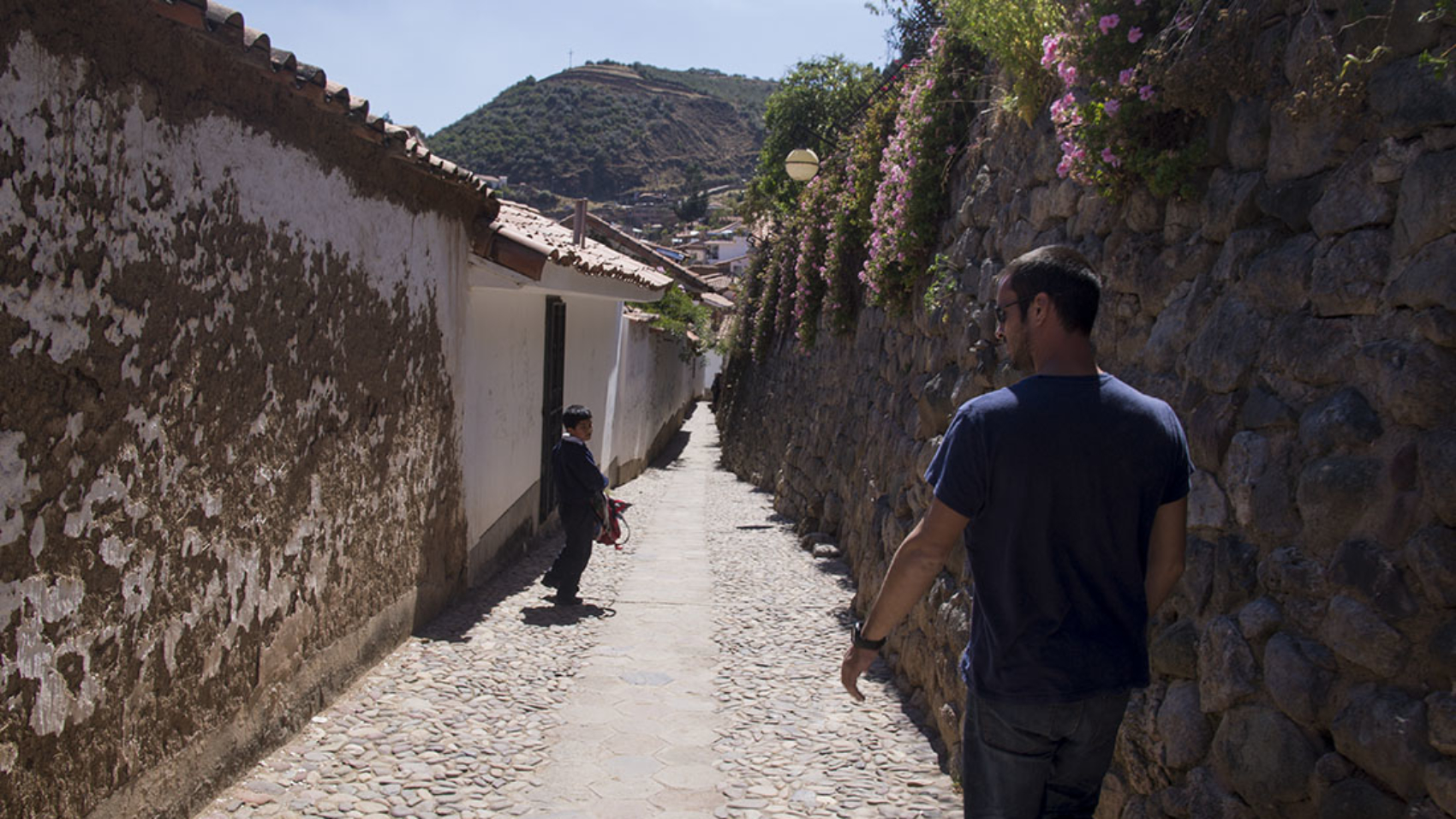 Matt walking down a back alley in Cusco