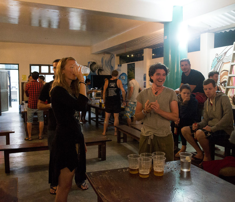 Hannah and Kyle playing beer pong, Loki del Mar, Mancora