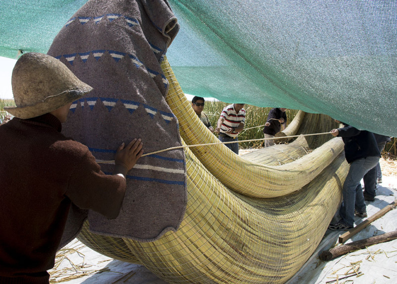 launching a reed boat in Los Uros, Lake Titicaca