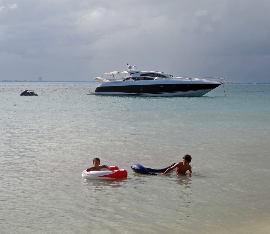 family on beach in Isla Mujeres