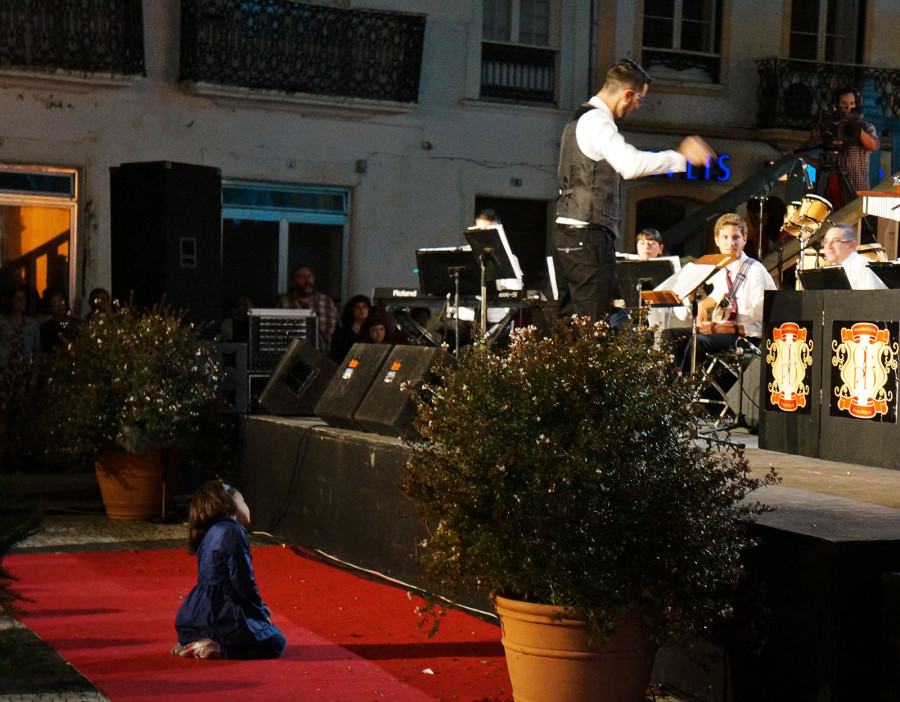 little girl watching orchestra