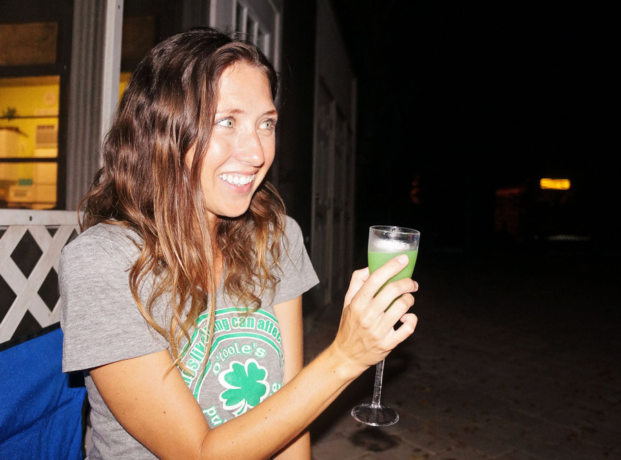 Jessica with a green cocktail