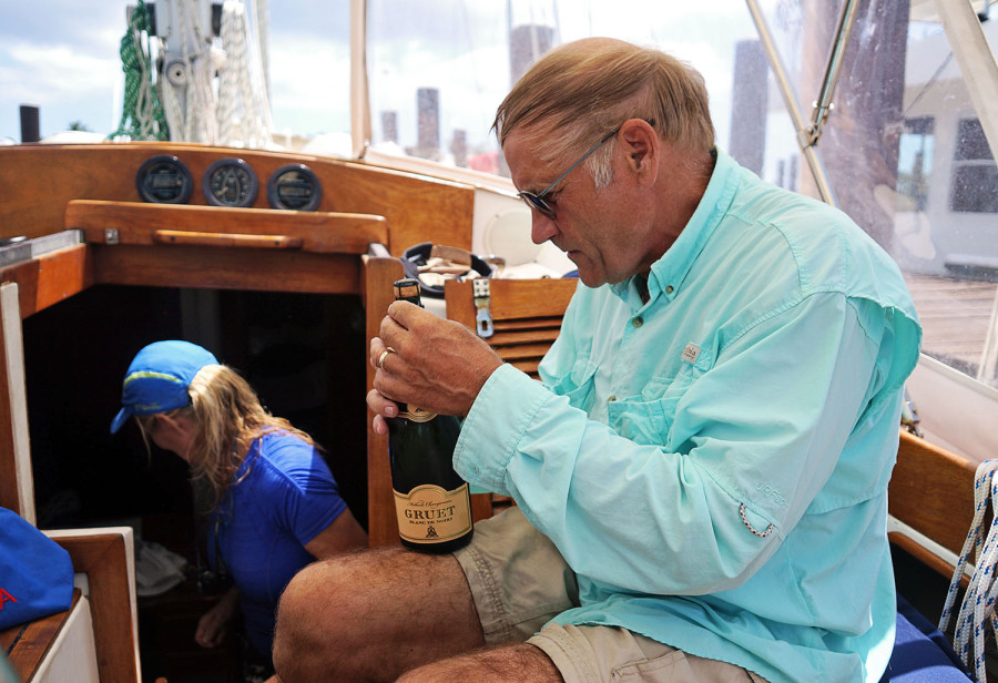 Bob opening champagne