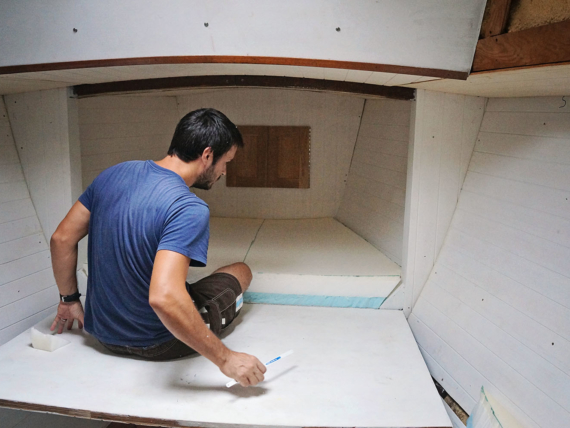 Matt installing v-berth foam