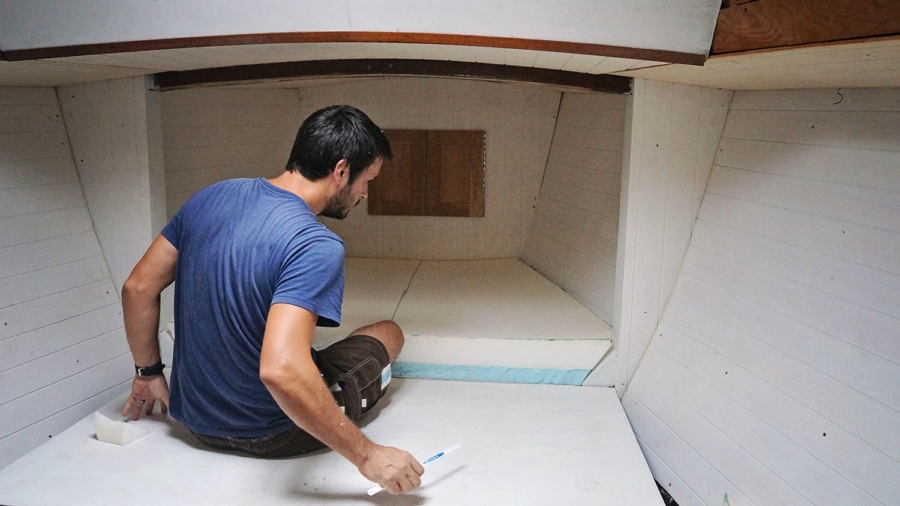 Matt installing v-berth foam