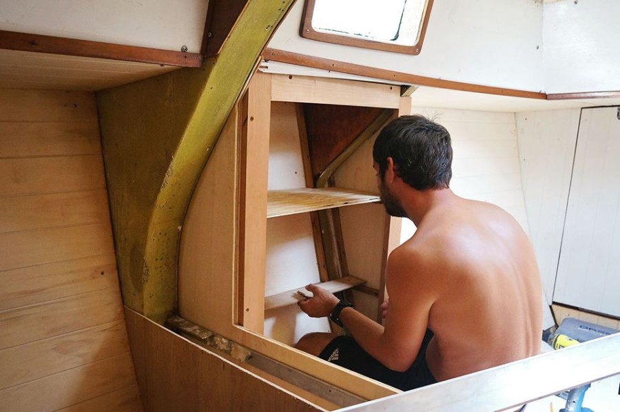 Matt installing cabinet shelves