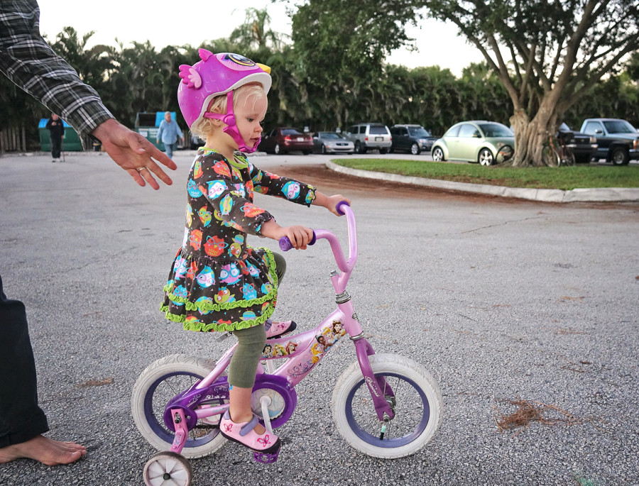 Ani riding a bicycle