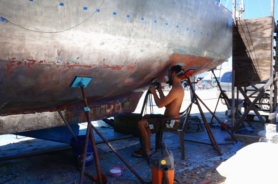 Matt sanding off bottom paint